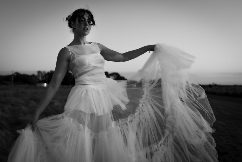 portrait of a girl wearing a beautiful tulle dress in black and white